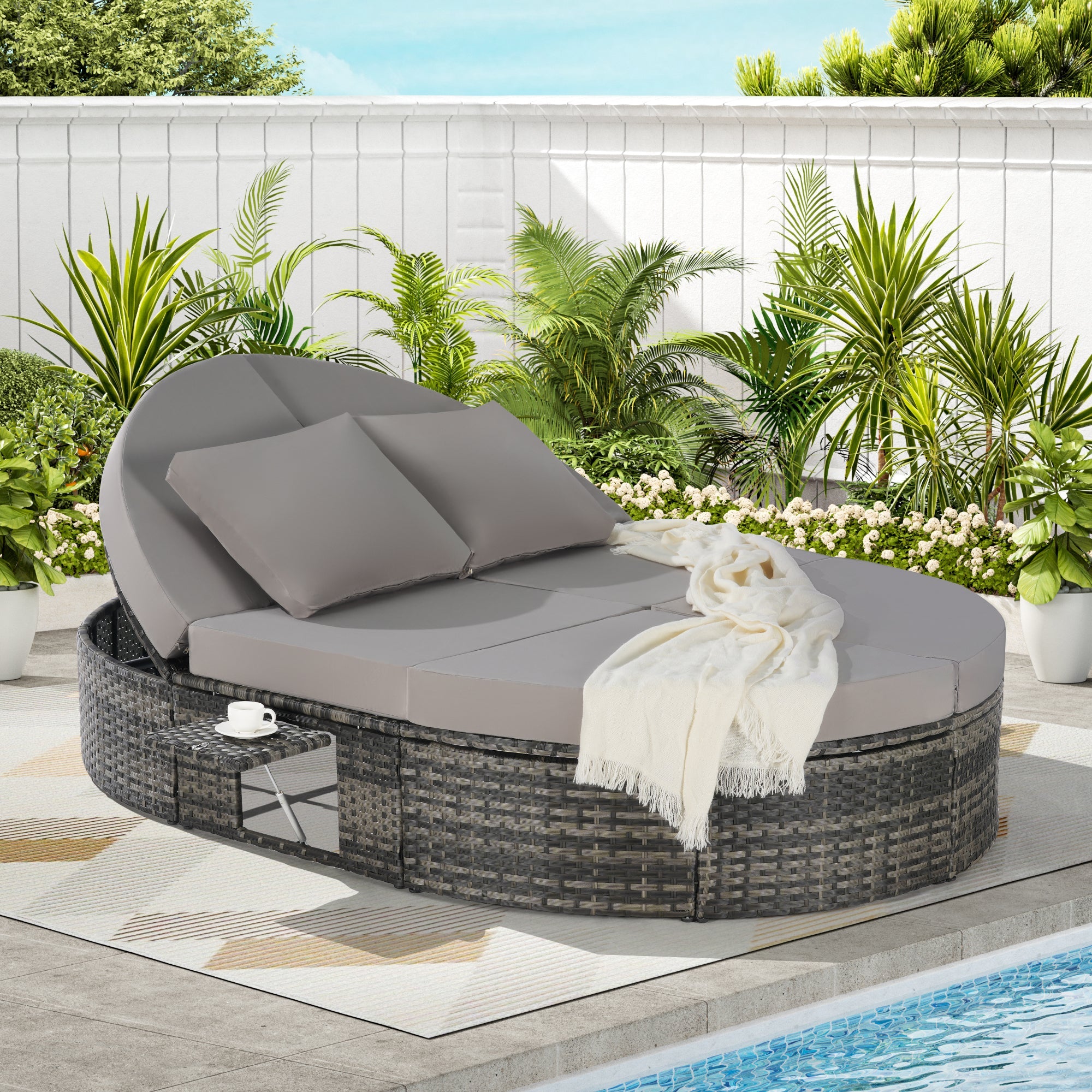 Round outdoor patio daybed with adjustable backrests foldable cup trays and cushioned wicker design ideal for backyard and poolside lounging